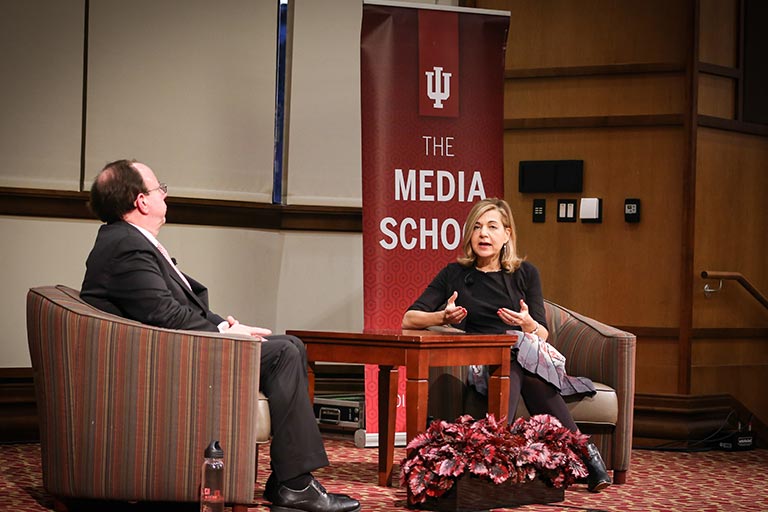 Two professionals chat during an interview.